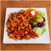 Stukjes kipfilet met paprika en ui